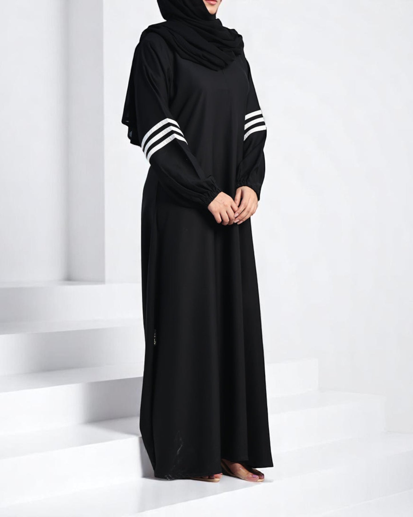 Black A-Line Closed Abaya in Firdaus Fabric with White Sleeve Stripes & Elasticated Cuffs