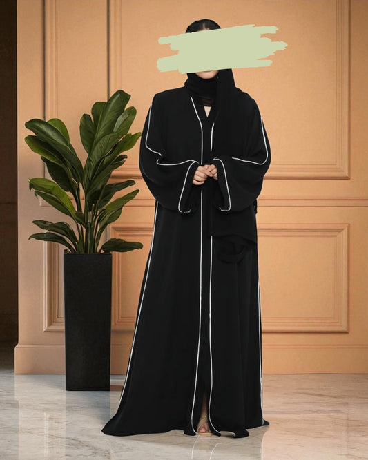 Black Front-Open Abaya in Firdaus Fabric with White Piping, Side Pockets & Snap Buttons