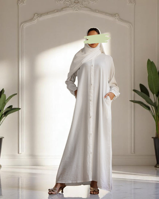 A-Line Closed White Abaya in CYE Crush Fabric with Show Buttons, Wide Sleeves, Pockets & V-Neck